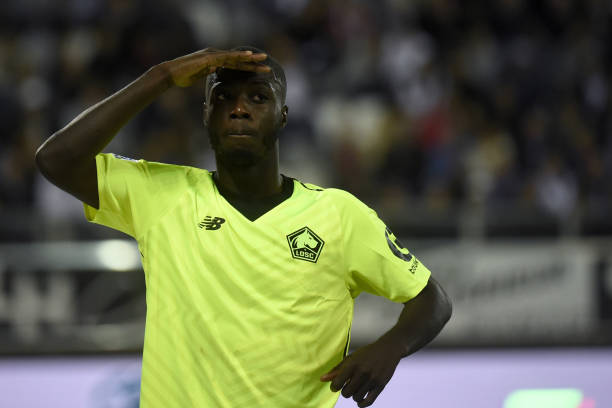 Lille's Ivorian forward Nicolas Pepe celebrates after scoring a goal during the French L1 football match between Amiens and Lille at the Licorne st...