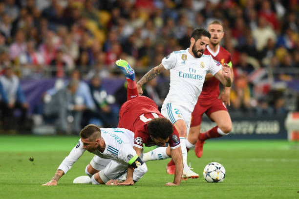 Arsenal 'positioned to welcome' €30m Lucas Vazquez in January 3 KIEV, UKRAINE - MAY 26: Mohamed Salah of Liverpool falls and lands on his shoulder after a collision with Sergio Ramos of Real Madrid, leading to him going off injured during the UEFA Champions League Final between Real Madrid and Liverpool at NSC Olimpiyskiy Stadium on May 26, 2018 in Kiev, Ukraine. (Photo by Michael Regan/Getty Images)