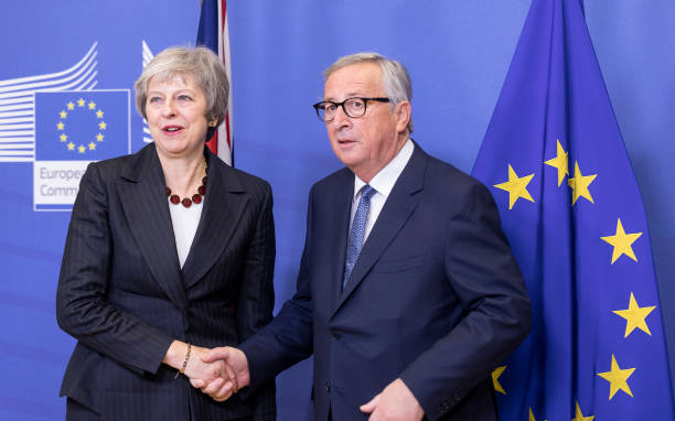BRUSSELS, BELGIUM - NOVEMBER 21: Prime Minister of the United Kingdom Theresa May (L) is welcomed by the President of the European Commission Jean-Claude Juncker (R) in the Berlaymont, the EU Commission headquarters on November 21, 2018 in Brussels, Belgium. British Prime Minister Theresa May will meet the President of the EU Commission to prepare for the Brexit EU Summit on November 25, 2018 (Photo by Thierry Monasse/Getty Images)