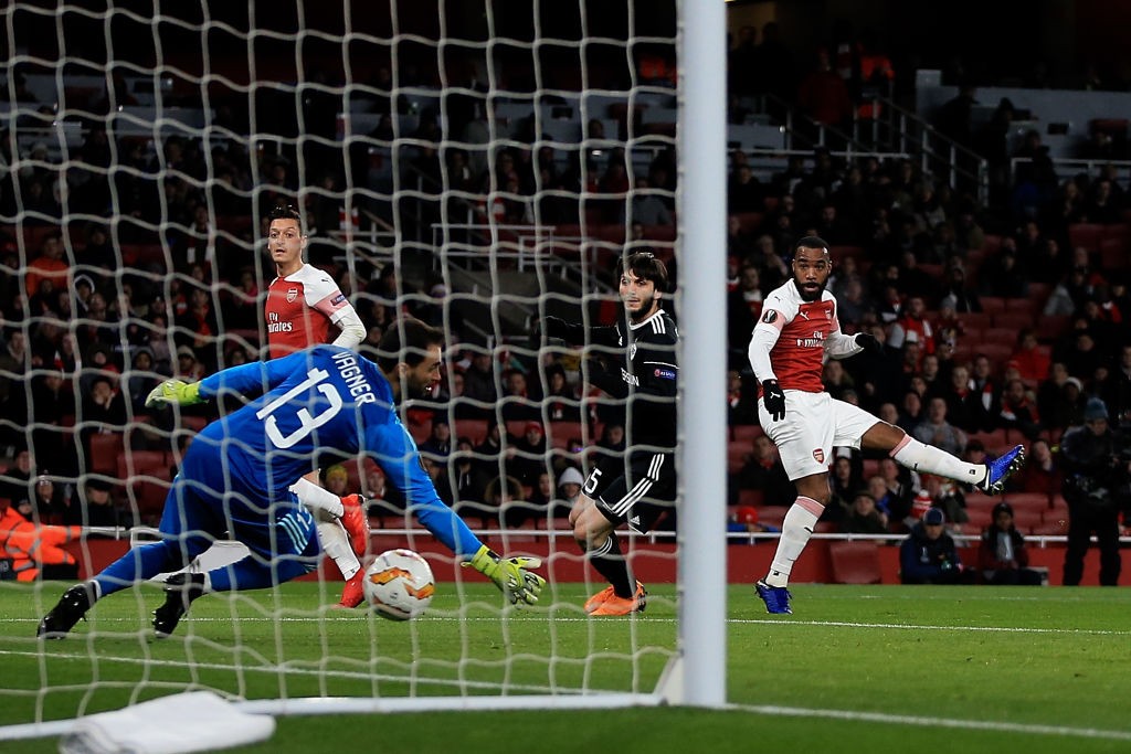 LONDON, ENGLAND - DECEMBER 13: Alexandre Lacazette of Arsenal scores the opening goal of the game during the UEFA Europa League Group E match betwe...