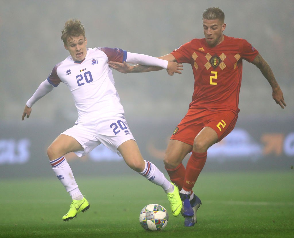 BRUSSELS, BELGIUM - NOVEMBER 15: Arnor Sigurdsson of Iceland is challenged by Toby Alderweireld of Belgium during the UEFA Nations League A group t...