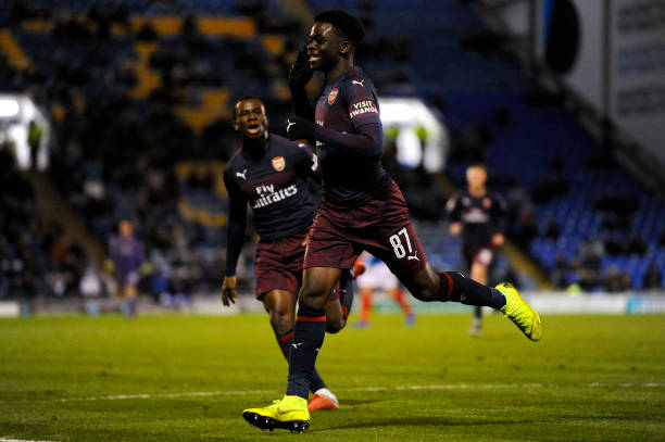 PORTSMOUTH, ENGLAND - DECEMBER 04: Bukayo Saka of Arsenal celebrates scoring his team's first goal during the Checkatrade Trophy match between Port...