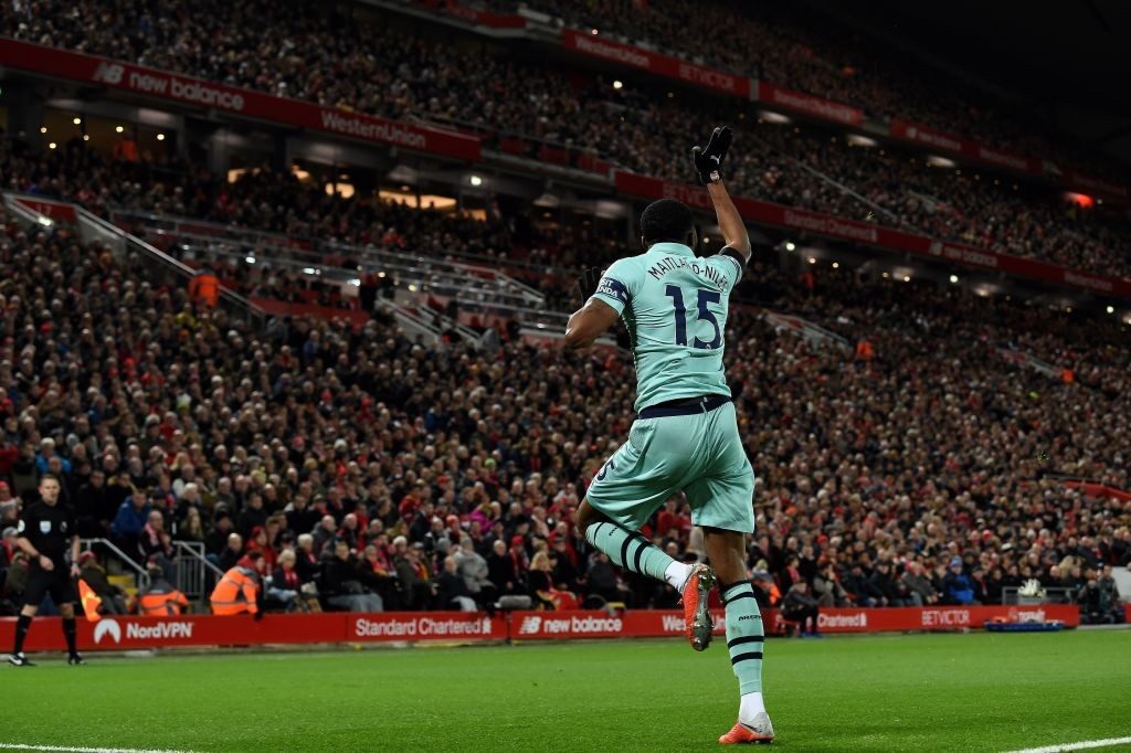 Arsenal's English midfielder Ainsley Maitland-Niles celebrates scoring the opening goal during the English Premier League football match between Liverpool and Arsenal at Anfield in Liverpool, north west England on December 29, 2018. (Photo by Paul ELLIS / AFP)