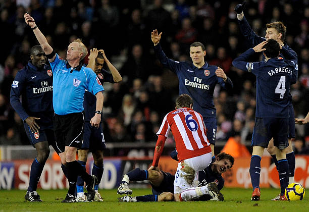 Tony Pulis refuses to deny Arsenal allegations 4 STOKE ON TRENT, ENGLAND - FEBRUARY 27: Aaron Ramsey of Arsenal lies seriously injured following a challenge by Ryan Shawcross of Stoke City during the Barclays Premier League match between Stoke City and Arsenal at The Britannia Stadium on February 27, 2010 in Stoke on Trent, England. (Photo by Laurence Griffiths/Getty Images)