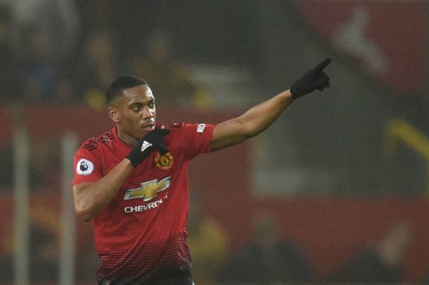 Manchester United's French striker Anthony Martial celebrates scoring their first goal to equalise 1-1 during the English Premier League football m...