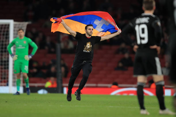 LONDON, ENGLAND - DECEMBER 13: Pitch invader during the UEFA Europa League Group E match between Arsenal and Qarabag FK at Emirates Stadium on Dece...