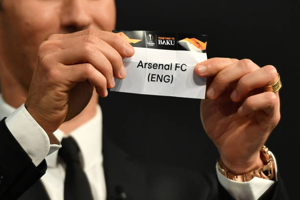 Former Portuguese football player Ricardo Carvalho shows the slip of Arsenal FC during the draw for the round of 32 of the UEFA Europa League footb...