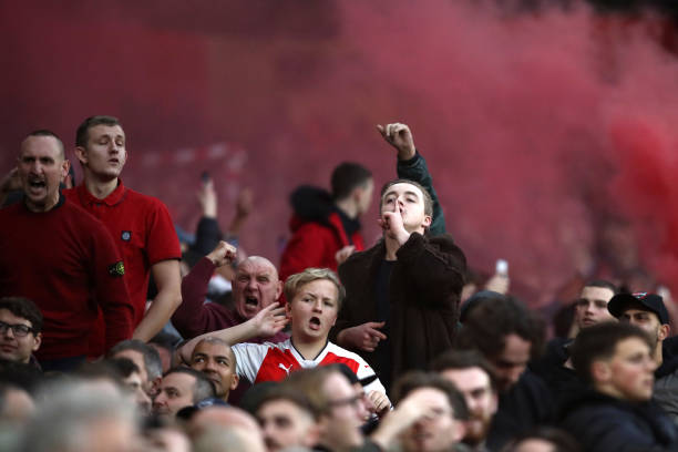 LONDON, ENGLAND - DECEMBER 02: Arsenal fans celebrate during the Premier League match between Arsenal FC and Tottenham Hotspur at Emirates Stadium ...