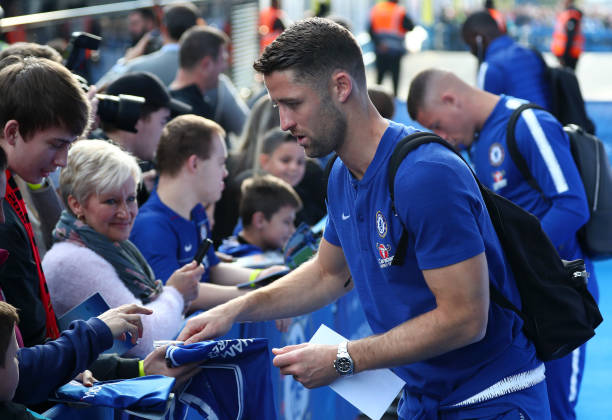 LONDON, ENGLAND - OCTOBER 20: Gary Cahill of Chelsea signs autographs prior to the Premier League match between Chelsea FC and Manchester United at...