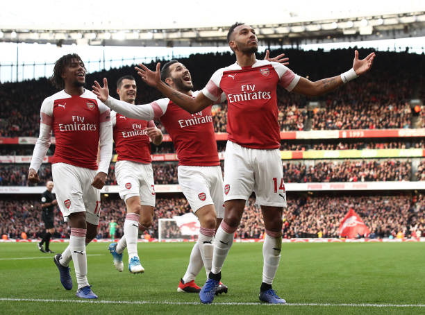 LONDON, ENGLAND - DECEMBER 02: Pierre-Emerick Aubameyang of Arsenal celebrates scoring from the penalty spot during the Premier League match betwee...