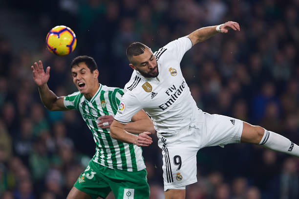 Arsenal probe Aissa Mandi's €30m release clause 2 SEVILLE, SPAIN - JANUARY 13: Aissa Mandi of Real Betis Balompie (L) competes for the ball with Karim Benzema of Real Madrid CF (R) during the La Liga match between Real Betis Balompie and Real Madrid CF at Estadio Benito Villamarin on January 13, 2019 in Seville, Spain. (Photo by Aitor Alcalde/Getty Images)
