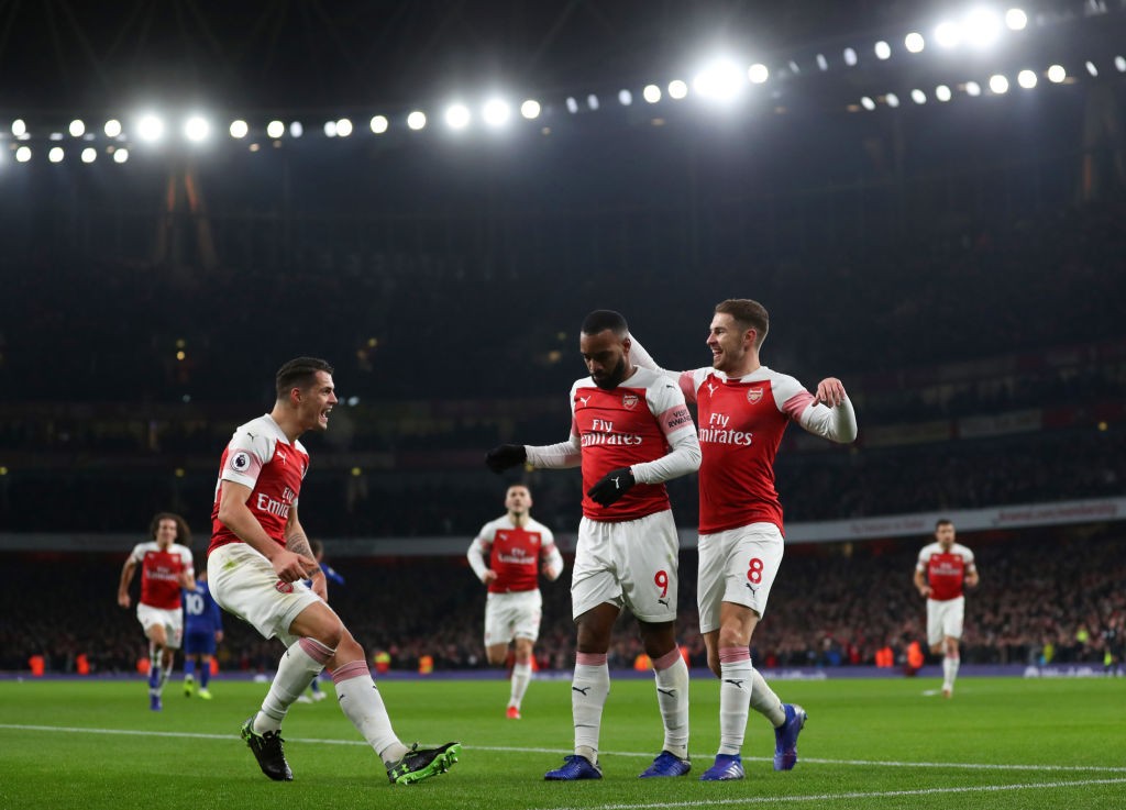 LONDON, ENGLAND - JANUARY 19: Alexandre Lacazette of Arsenal celebrates scoring his teams first goal with Granit Xhaka and Aaron Ramsey during the ...