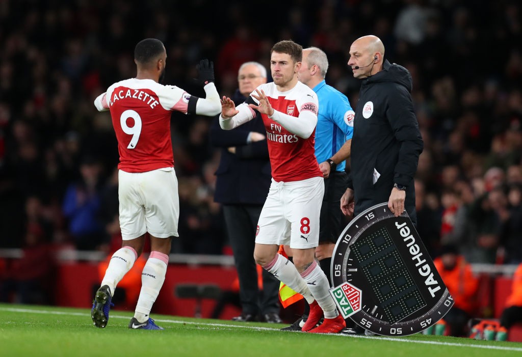 LONDON, ENGLAND - JANUARY 01: Alexandre Lacazette of Arsenal is substituted for Aaron Ramsey of Arsenal during the Premier League match between Ars...