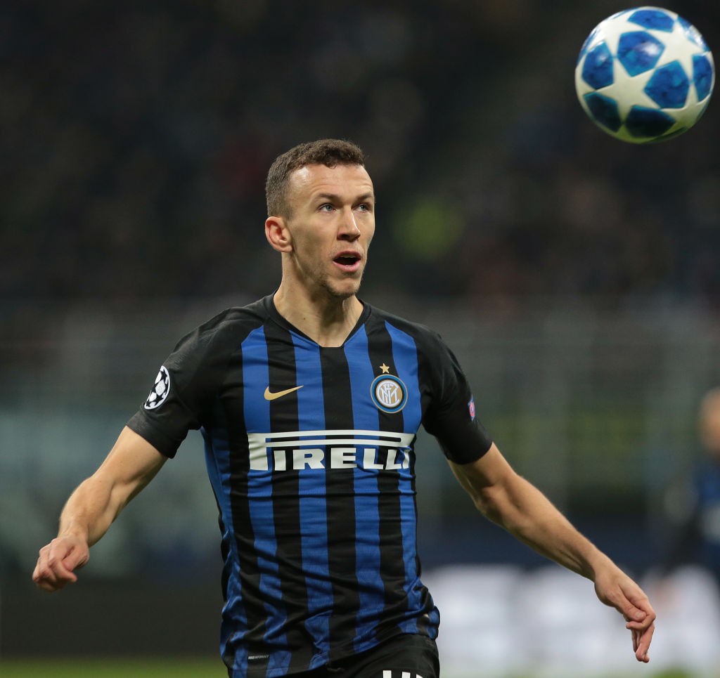 MILAN, ITALY - DECEMBER 11: Ivan Perisic of FC Internazionale looks the ball during the UEFA Champions League Group B match between FC Internaziona...