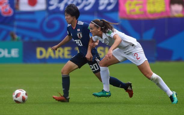 England's defender Anna Patten (R) vies with Japan's midfielder Jun Endo during the Women's U20 World Cup semi-final football match between England...