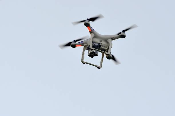A drone flies above the pitch to record a training session of French L1 football club Girondins de Bordeaux's on January 11, 2018 at the Haillan tr...