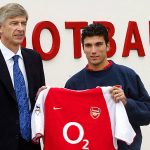 LONDON, UNITED KINGDOM: Arsenal's manager Arsene Wenger (L) poses with newly signed Jose Antonio Reyes (R) at the Arsenal training centre in London 30 January 2004. The 20-year-old striker, who joined from Seville in a deal totalling 17 million pounds (30 million dollars), may have to wait for his English debut as Arsenal are waiting to hear if the international clearance given to Reyes by the Spanish FA will include the fact he is subject to a one-match club suspension. AFP PHOTO Nicolas ASFOURI