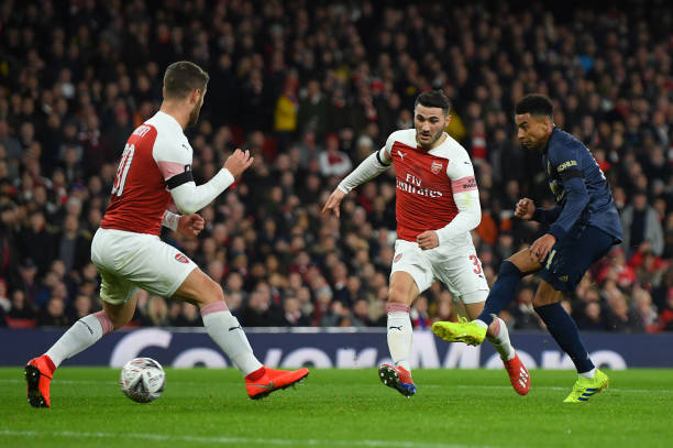 LONDON, ENGLAND - JANUARY 25:  Jesse Lingard of Manchester United scores scores his team's second goal as Sead Kolasinac and Shkodran Mustafi of Arsenal look on during the FA Cup Fourth Round match between Arsenal and Manchester United at Emirates Stadium on January 25, 2019 in London, United Kingdom. (Photo by Mike Hewitt/Getty Images)