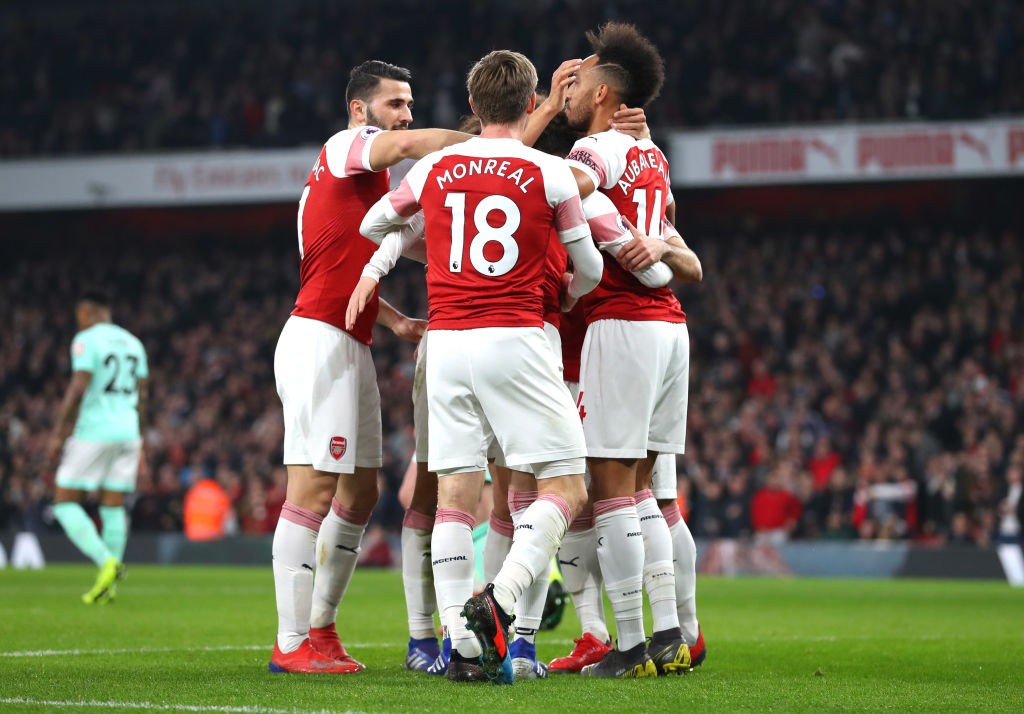 LONDON, ENGLAND - FEBRUARY 27: Henrikh Mkhitaryan of Arsenal celebrates after scoring his team's second goal with his team mates during the Premier...