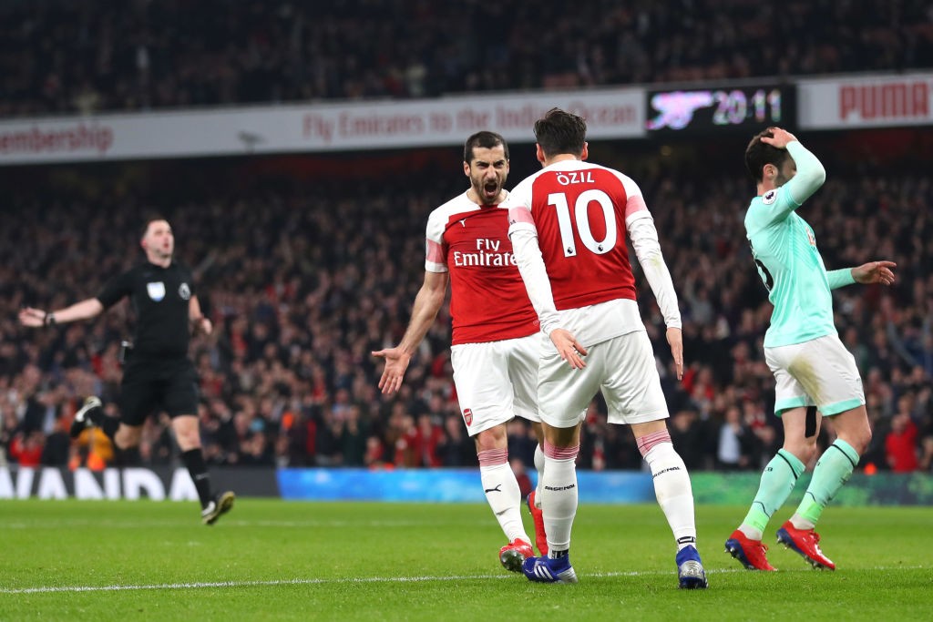 LONDON, ENGLAND - FEBRUARY 27: Henrikh Mkhitaryan of Arsenal celebrates after scoring his team's second goal with Mesut Ozil of Arsenal during the ...