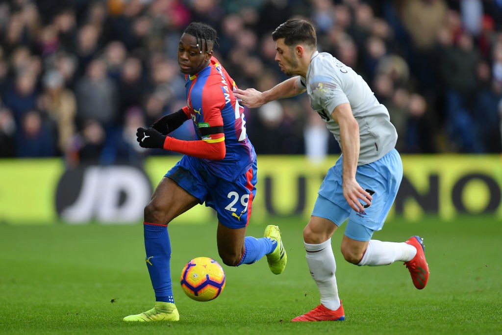 LONDON, ENGLAND - FEBRUARY 09: Aaron Wan-Bissaka of Crystal Palace battles for possession with Aaron Cresswell of West Ham United during the Premie...