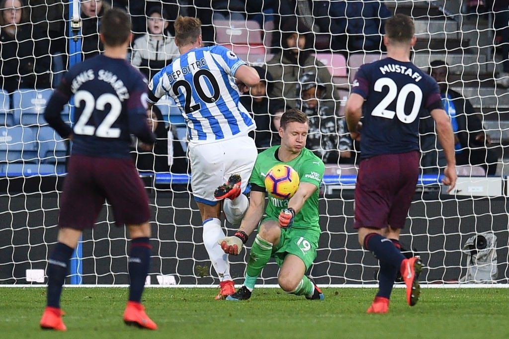 Player ratings vs Huddersfield Town: Injury-ravaged Arsenal scrape uninspiring win 2 Arsenal's German goalkeeper Bernd Leno (2R) saves a shot from Huddersfield Town's Belgian striker Laurent Depoitre (2L) during the English Premier League football match between Huddersfield Town and Arsenal at the John Smith's stadium in Huddersfield, northern England on February 9, 2019. (Photo by Oli SCARFF / AFP / Getty Images)