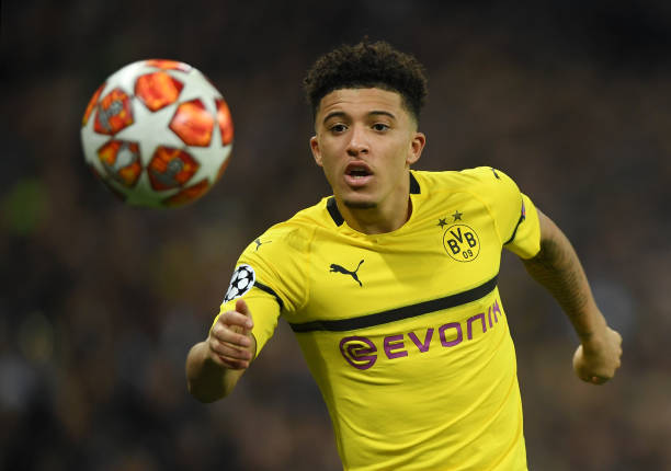 Jadon Sancho of Borussia Dortmund runs with the ball during the UEFA Champions League Round of 16 First Leg match between Tottenham Hotspur and Bor...