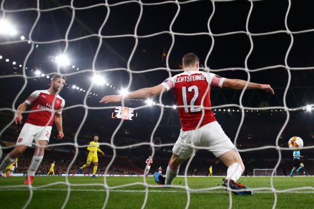 LONDON, ENGLAND - FEBRUARY 21: Stephan Lichtsteiner of Arsenal saves the ball on the line during the UEFA Europa League Round of 32 Second Leg matc...
