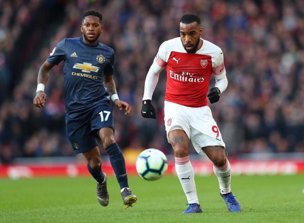 LONDON, ENGLAND - MARCH 10: Fred of Manchester United and Alexandre Lacazette of Arsenal during the Premier League match between Arsenal FC and Man...