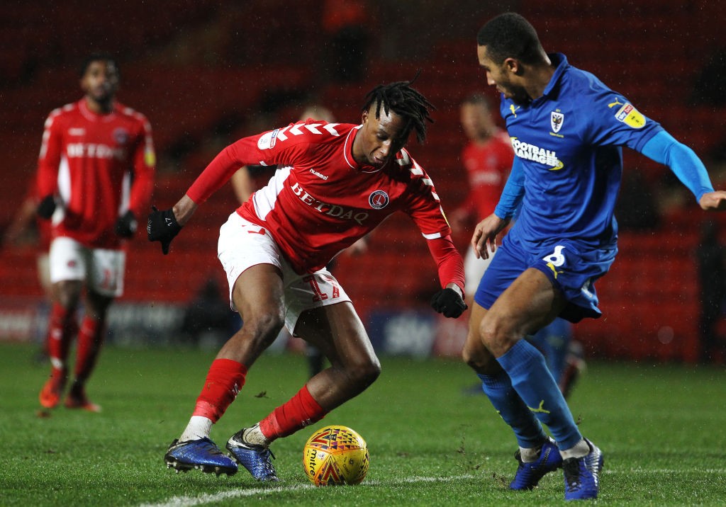 LONDON, ENGLAND - DECEMBER 15: (L-R) Joe Aribo of Charlton Athletic is challenged by Terell Thomas of AFC Wimbledon during the Sky Bet League One m...