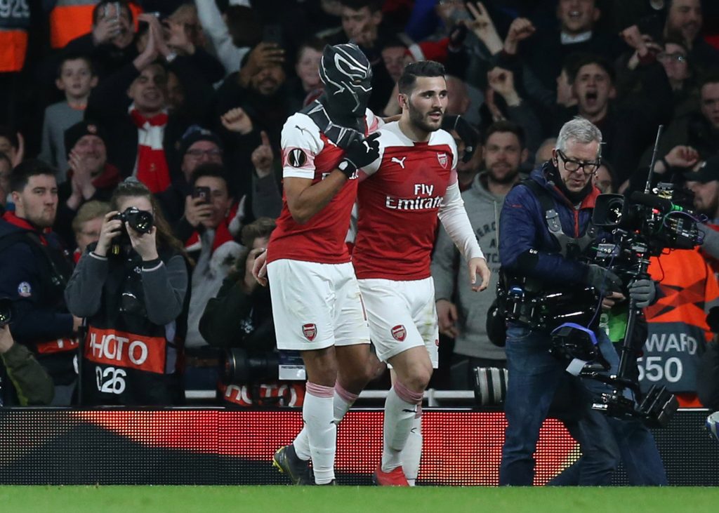 LONDON, ENGLAND - MARCH 14:  Pierre-Emerick Aubameyang of Arsenal dons a Black Panther mask as he celebrates after scoring his team's third goal with Sead Kolasinac of Arsenal during the UEFA Europa League Round of 16 Second Leg match between Arsenal and Stade Rennais at Emirates Stadium on March 14, 2019, in London, England. (Photo by Alex Morton/Getty Images)