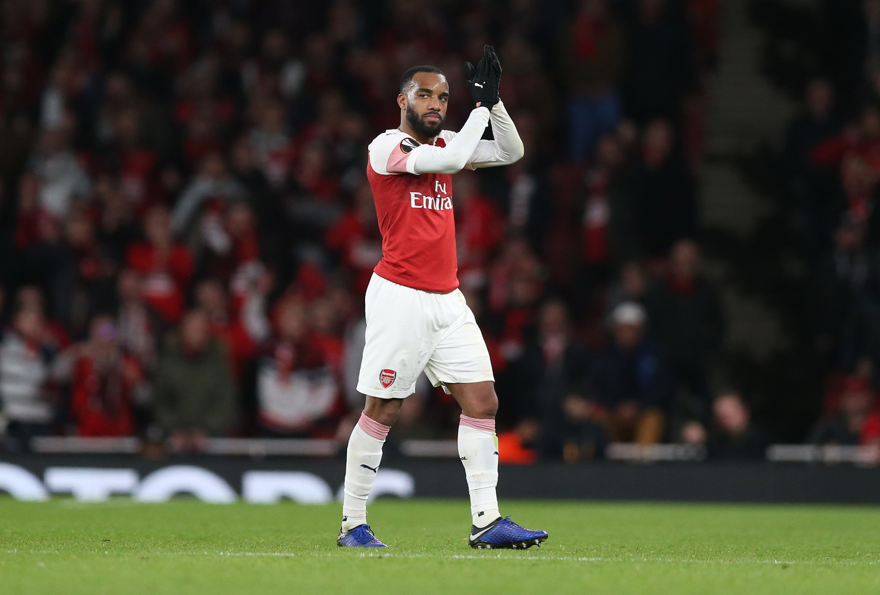 Alexandre Lacazette of Arsenal  applauds fans as he is substituted during the UEFA Europa League Round of 16 Second Leg match between Arsenal and S...