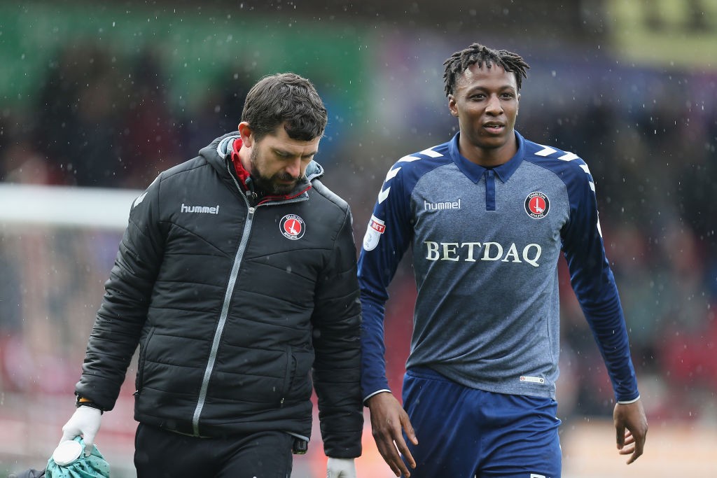 NORTHAMPTON, ENGLAND - MARCH 30: Joe Aribo of Charlton Athletic leaves the pitch with Alastair Thrush during the Sky Bet League One match between N...