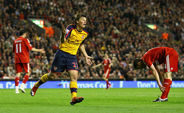LIVERPOOL, UNITED KINGDOM - APRIL 21: Andrey Arshavin of Arsenal celebrates scoring his team's third goal and his hat trick during the Barclays Pre...