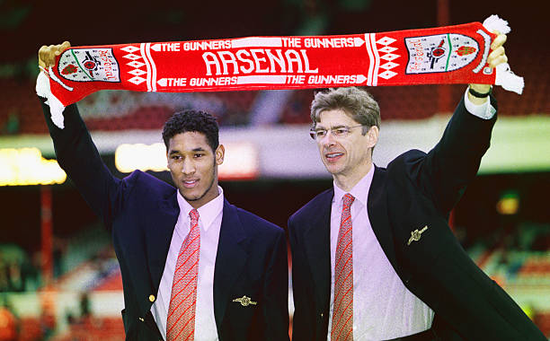 2-hour Nicolas Anelka Netflix documentary announced 2 LONDON, UNITED KINGDOM - FEBRUARY 24: Arsenal manager Arsene Wenger (r) and new signing Nicolas Anelka pictured before an FA Carling Premiership match between Arsenal and Wimbledon at Highbury on February 24, 1997 in London, England. (Photo by Ben Radford/Allsport/Getty Images)