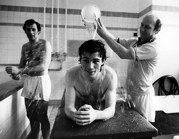 2nd April 1979: Water is poured over the back of Frank Stapleton of Arsenal as he receives treatment in the changing rooms. (Photo by Evening Standard/Getty Images)