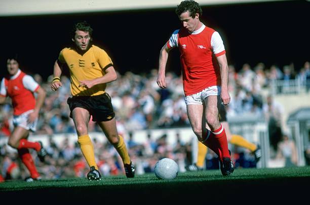 OTD Liam Brady makes his Arsenal debut 2 Oct 1979: Liam Brady of Arsenal in action during a Football League Division One match against Wolverhampton Wanderers at the Molineux Grounds in Wolverhampton, England. Mandatory Credit: Allsport UK /Allsport
