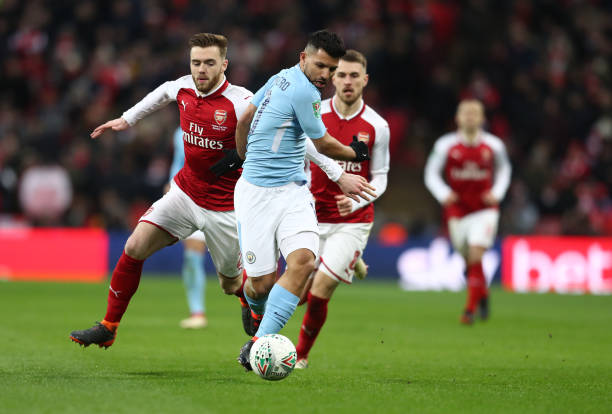 Arsenal wages revealed 26 LONDON, ENGLAND - FEBRUARY 25: Sergio Aguero of Manchester City battles with Calum Chambers of Arsenal during the Carabao Cup Final between Arsenal and Manchester City at Wembley Stadium on February 25, 2018 in London, England. (Photo by Catherine Ivill/Getty Images)