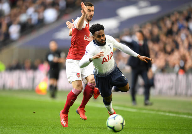 LONDON, ENGLAND - MARCH 02: Henrikh Mkhitaryan of Arsenal battles for possession with Danny Rose of Tottenham Hotspur during the Premier League match between Tottenham Hotspur and Arsenal FC at Wembley Stadium on March 02, 2019 in London, United Kingdom. (Photo by Michael Regan/Getty Images)
