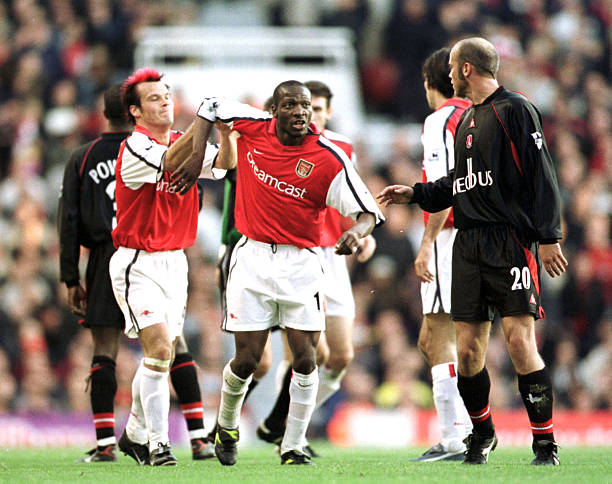 12 programmes: Arsenal on TV - 19 March 2019 13 4 Nov 2001: Lauren of Arsenal argues with Claus Jensen of Charlton during the FA Barclaycard Premiership match between Arsenal and Charlton at Highbury, London Mandatory Credit: Mark Thompson/ALLSPORT