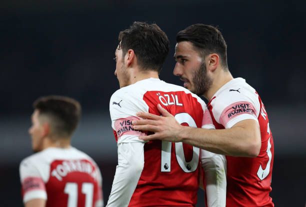 LONDON, ENGLAND - FEBRUARY 27: Sead Kolasinac of Arsenal speaks to Mesut Ozil of Arsenal during the Premier League match between Arsenal FC and AFC...