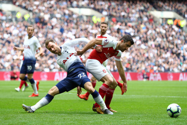 LONDON, ENGLAND - MARCH 02: Christian Eriksen of Tottenham Hotspur battles for possession with Sokratis Papastathopoulos of Arsenal during the Prem...