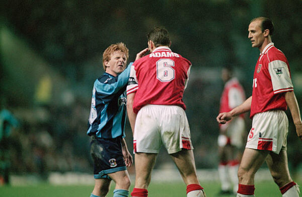 From left to right, midfielder Gordon Strachan of Coventry City, and defenders Tony Adams and Steve Bould of Arsenal, during an FA Carling Premiership match at Highfield Road in Coventry, UK, 21st April 1997. The score was 1-1. (Photo by Ben Radford/Getty Images)