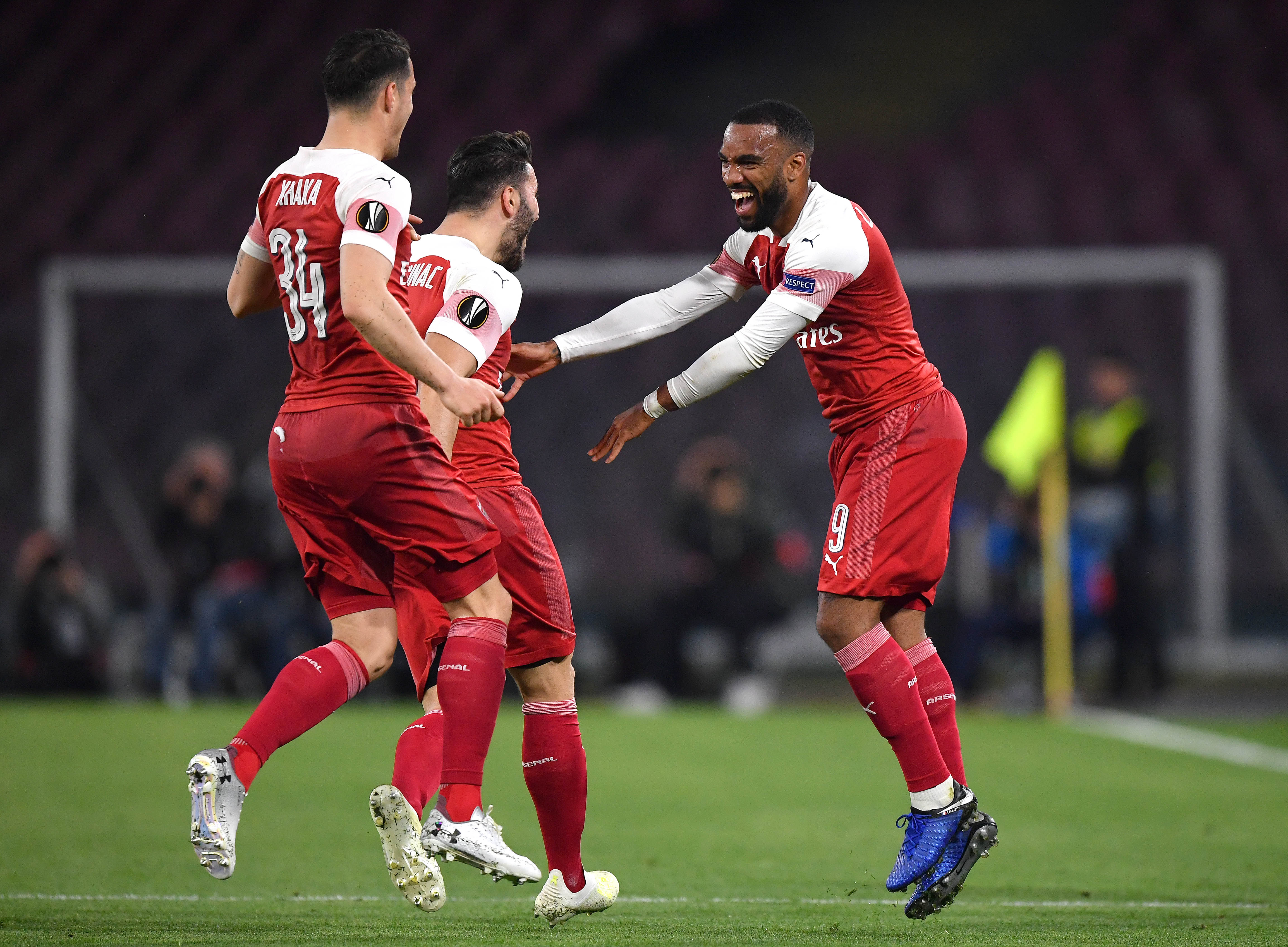 Alexandre Lacazette of Arsenal celebrates scoring his sides first goal with Granit Xhaka and Sead Kolasinac during the UEFA Europa League Quarter F...