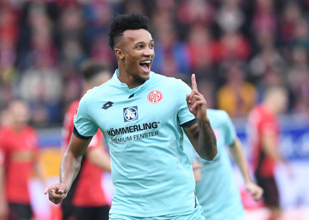 FREIBURG GERMANY - NOVEMBER 10: Jean-Philippe Gbamin of FSV Mainz 05 celebrate his opening goal during the Bundesliga match between Sport Club Frei...