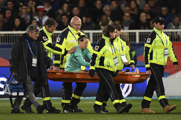 France's goalkeeper Pauline Peyraud-Magnin (C) is stretched out due to an injury during the FIFA international friendly football match between France and Japan at the Abbe-Deschamps Stadium in Auxerre, on April 4, 2019. (Photo by Anne-Christine POUJOULAT / AFP)