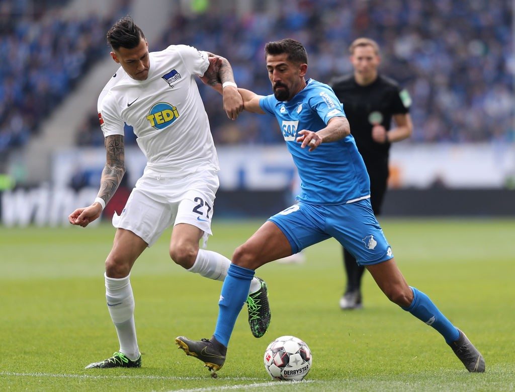 SINSHEIM, GERMANY - APRIL 14: Kerem Demirbay of Hoffenheim is challenged by Davie Selke of Berlin during the Bundesliga match between TSG 1899 Hoffenheim and Hertha BSC at PreZero-Arena on April 14, 2019 in Sinsheim, Germany. (Photo by Simon Hofmann/Bongarts/Getty Images)