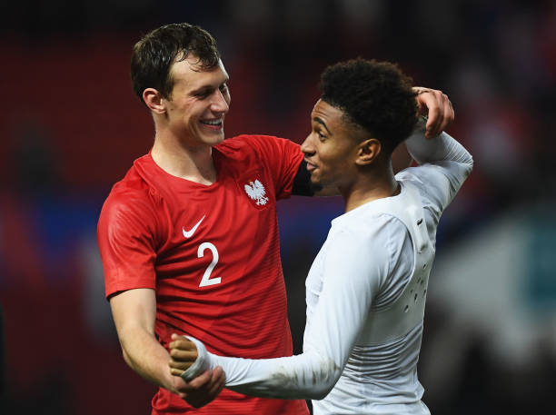 Unai Emery wanted to give Krystian Bielik a chance before club hierarchy agreed to sell 3 BRISTOL, ENGLAND - MARCH 21: Krystian Bielik of Poland and Reiss Nelson of England share a joke after the U21 International Friendly match between England and Poland at Ashton Gate on March 21, 2019 in Bristol, England. (Photo by Harry Trump/Getty Images)