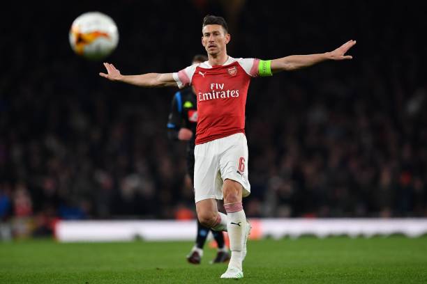 Arsenal's French defender Laurent Koscielny keeps an eye on the ball during the UEFA Europa League quarter final, first leg, football match between...