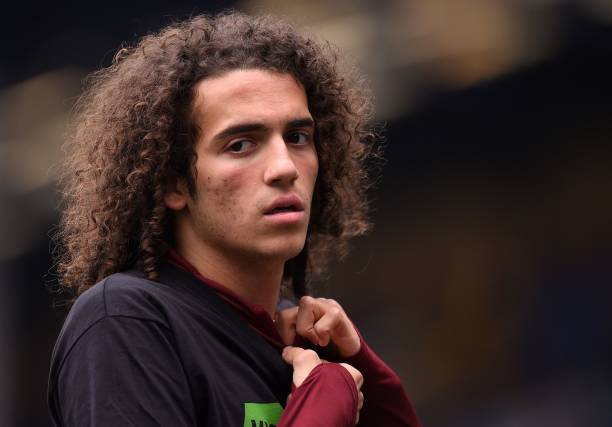 Arsenal's French midfielder Matteo Guendouzi warms up ahead of the English Premier League football match between Everton and Arsenal at Goodison Pa...